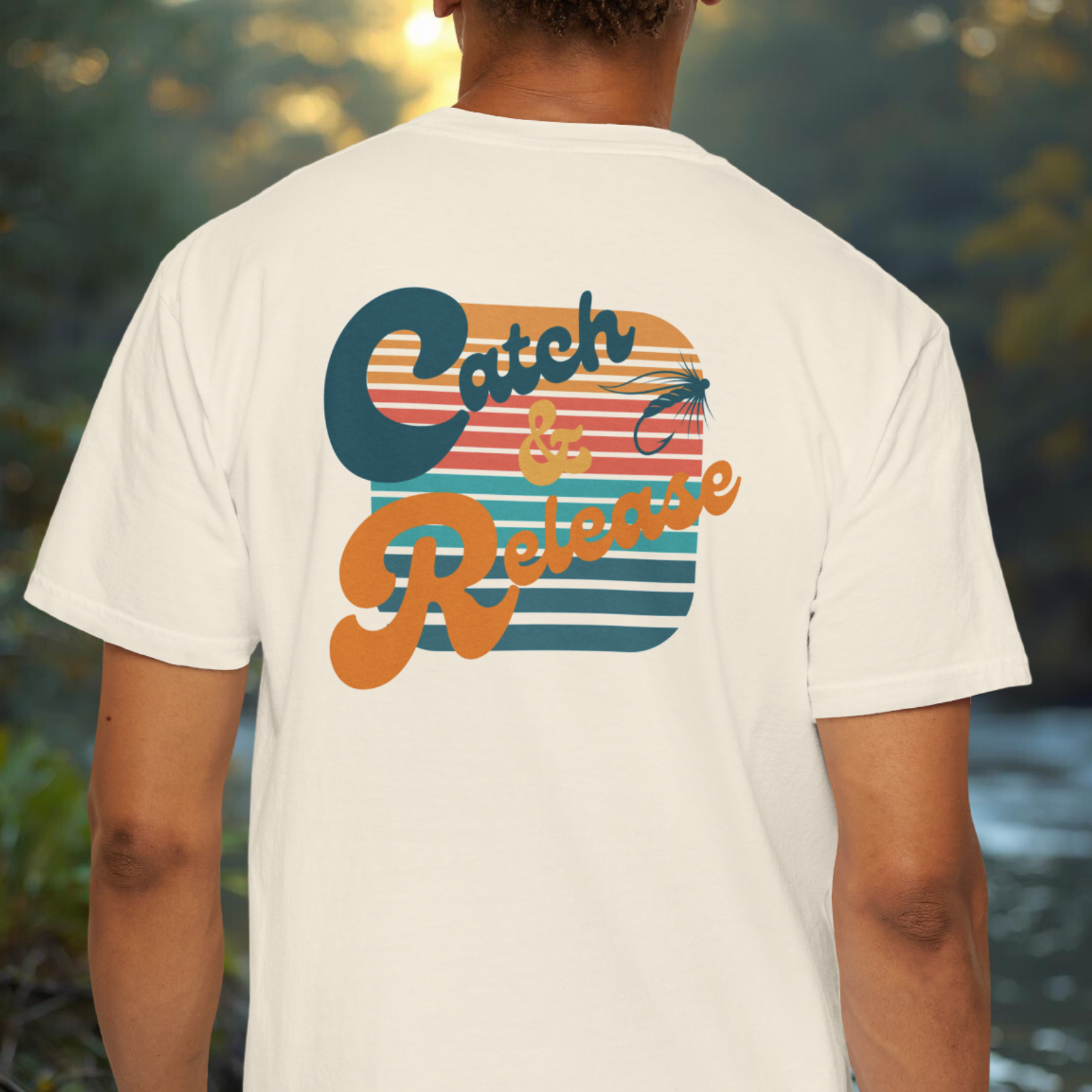 Model wearing the t-shirt showing the large “Catch & Release” retro graphic placement back view. 