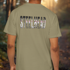 Model wearing khaki tee  showing the “STEELHEAD” graphic across the back.