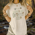 Lifestyle photo of a person wearing a light-colored tee with the “Some Who Wander Are Definitely Lost” design.