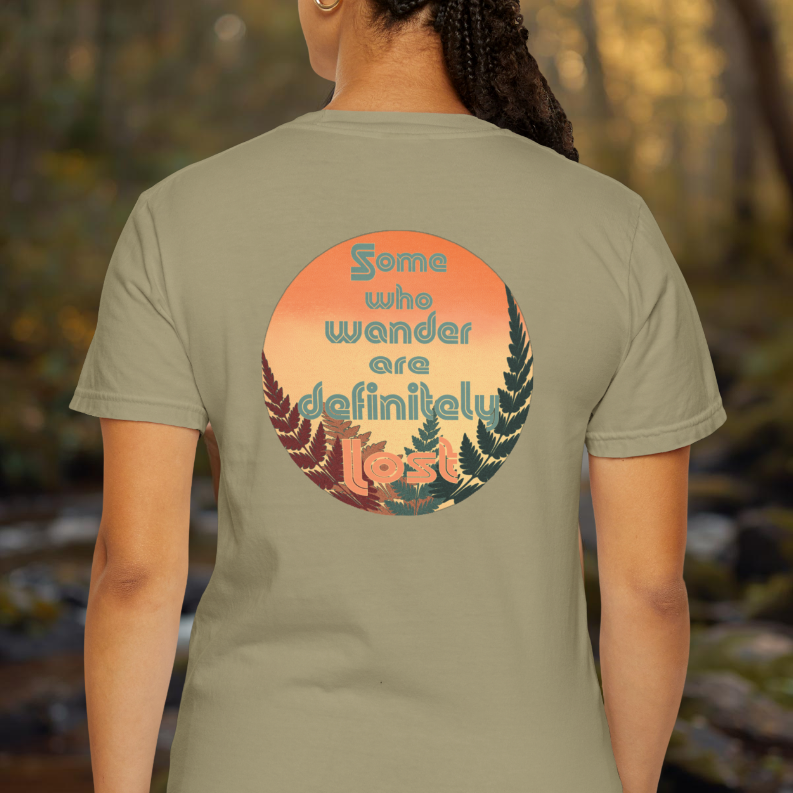Back view of a person wearing the tee showing the large sunset circle fern design on the back.