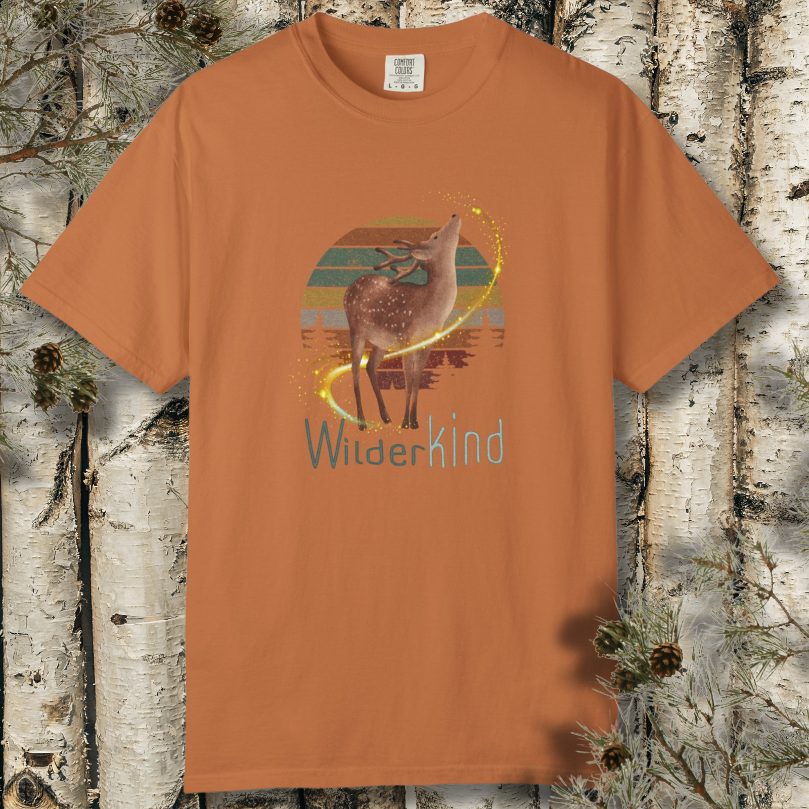 Deer in forest with vintage sunset and ‘WilderKind’ text on tee.