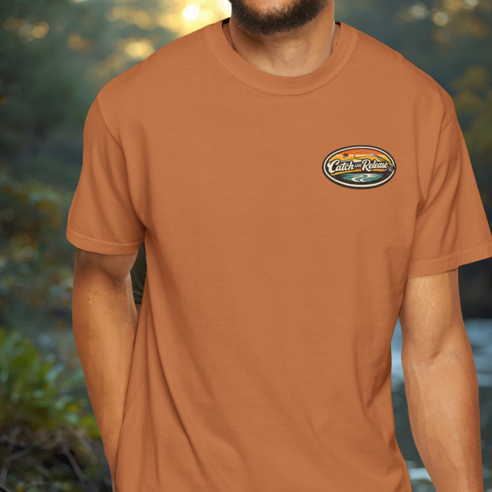 Front view of yam tee with a small oval “Catch & Release” chest badge detail.