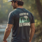 Lifestyle photo of a person wearing a dark fly fishing tee outdoors, relaxed fit.