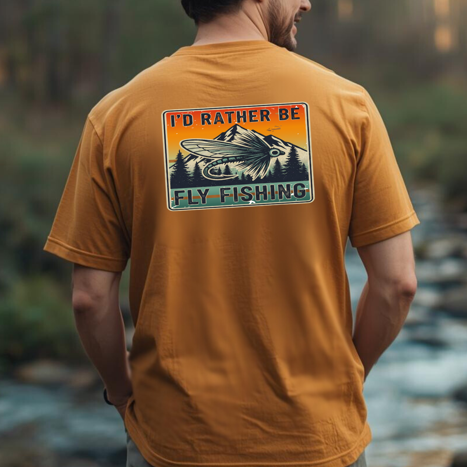 Lifestyle photo of person wearing a yam orange fly fishing t-shirt with back print badge graphic.