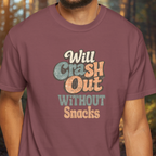 Maroon t-shirt with colorful text 'Will Crash Out Without Snacks' on a blurred background