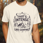 White t-shirt with camping-themed graphic and text worn by a person in a forest setting