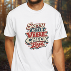 Person wearing a white t-shirt with colorful text design in a forest setting