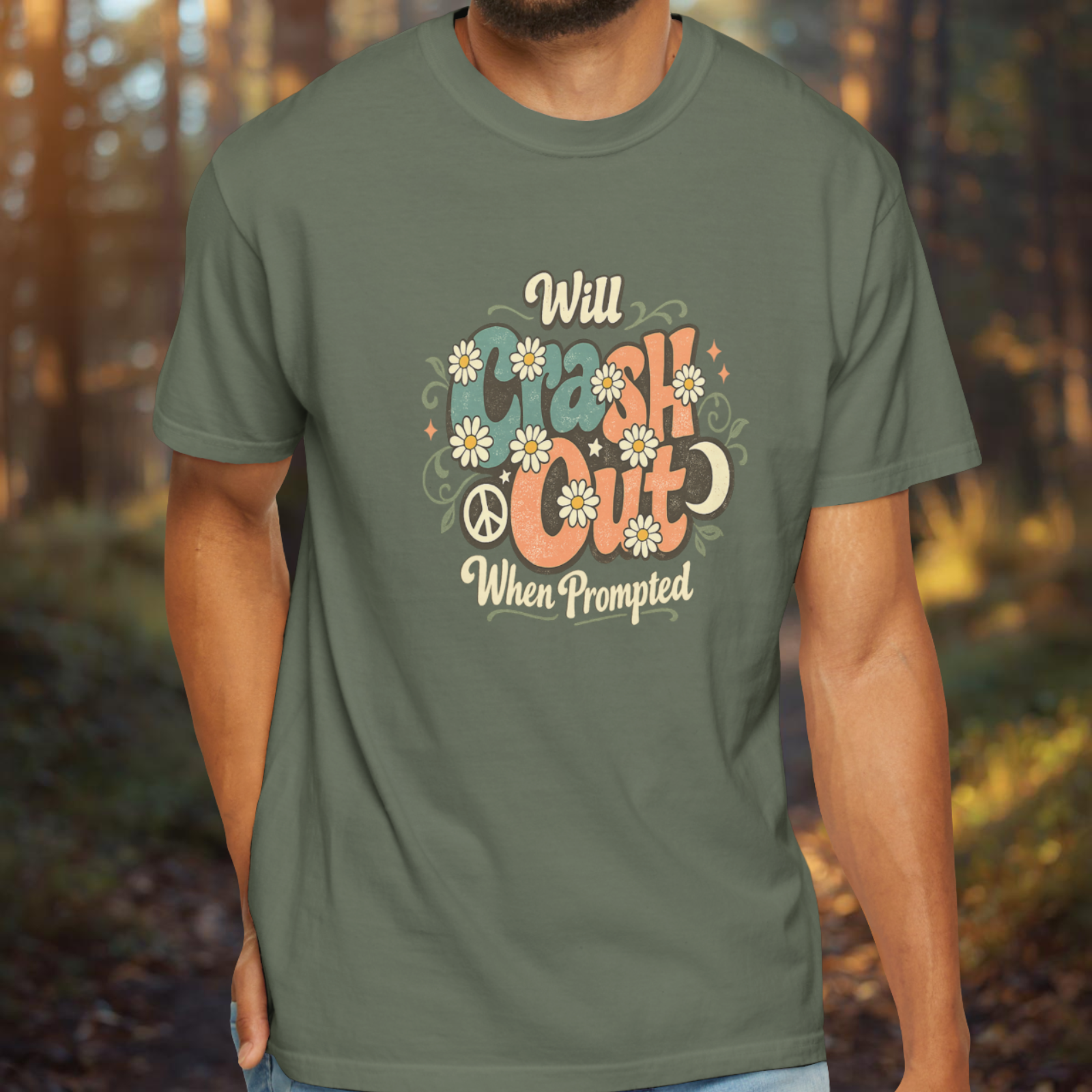 Person wearing a green t-shirt with a printed design in a forest setting