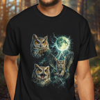 Person wearing a black t-shirt with owl design featuring a moon and stars in a forest setting.