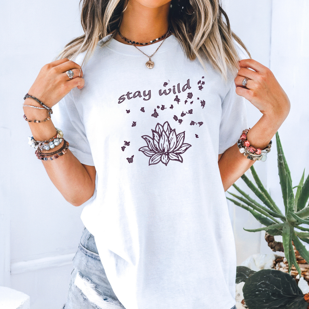 Woman wearing stay wild lotus and butterflies graphic t-shirt