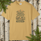 Mustard Yellow t-shirt with 'Trail Mixed Opinions, Mostly Salty' graphic design on a wooden background with pine branches.