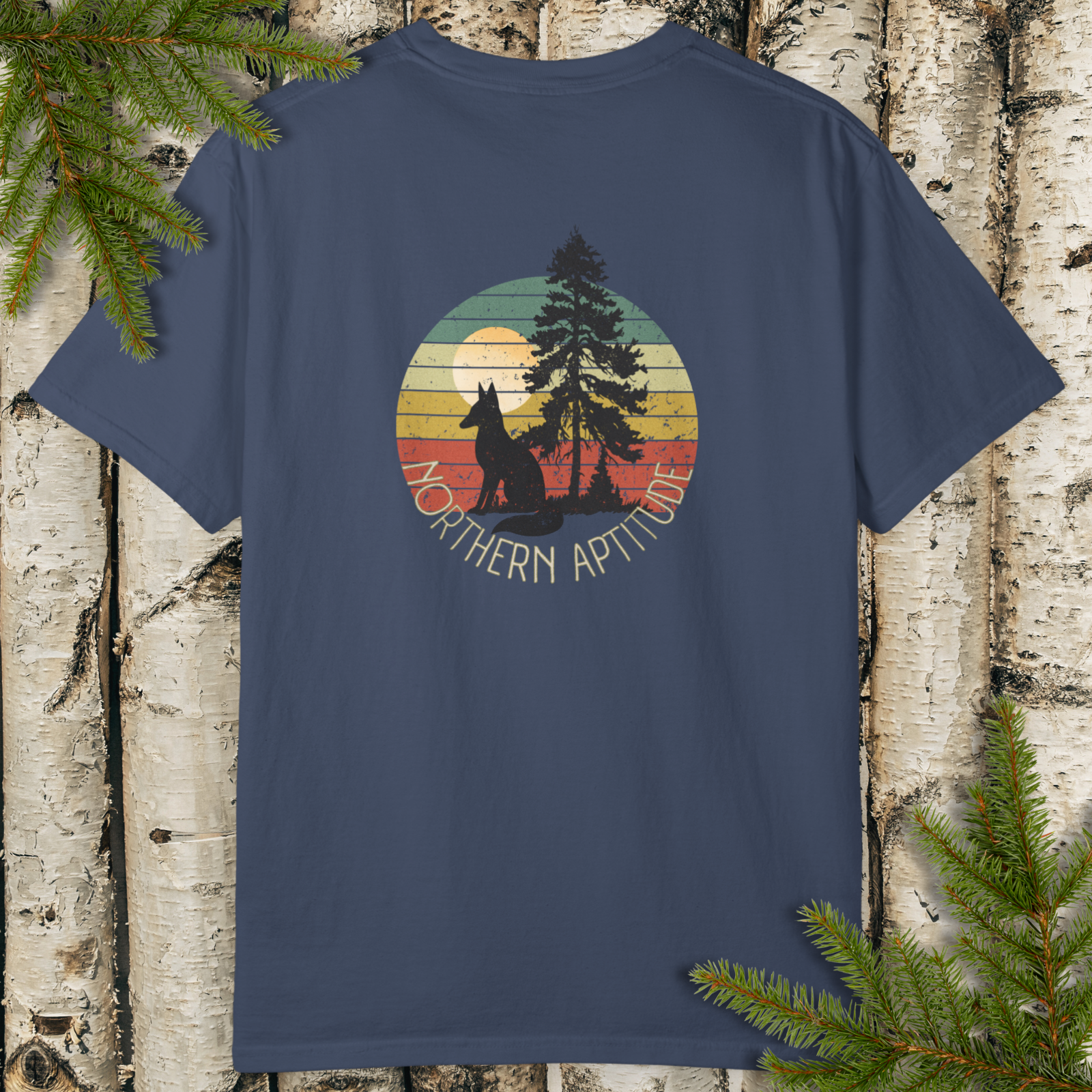 Midnight unisex t-shirt with a retro sunset circle back print graphic featuring a pine and fox silhouette, “Northern Aptitude” text at the bottom.