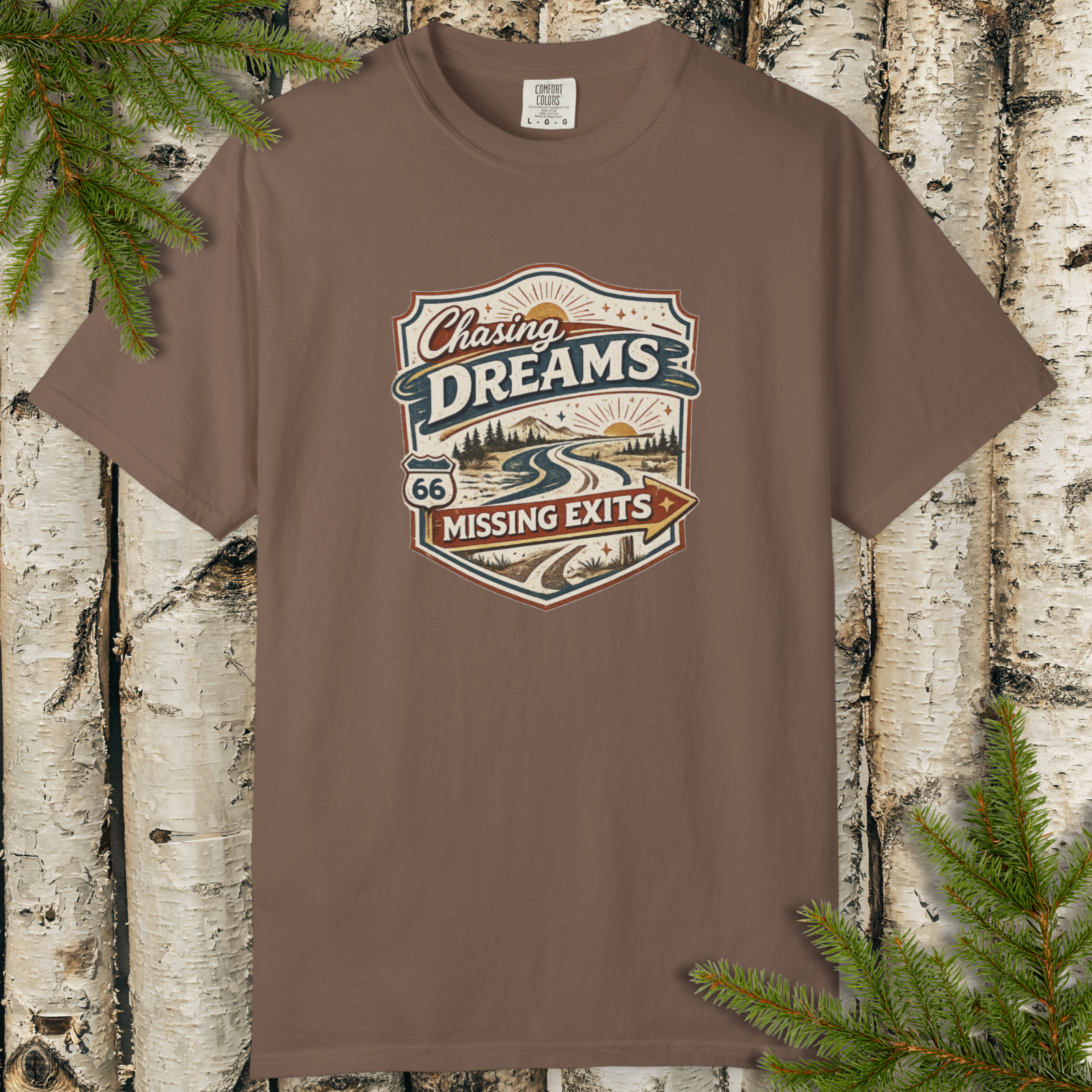 Flat lay of Chasing Dreams Missing Exits retro road trip t-shirt design.