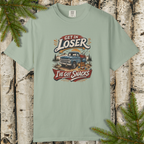 Flat lay of snack-themed vintage truck graphic light green tee with ‘Get In Loser I’ve Got Snacks’ text.