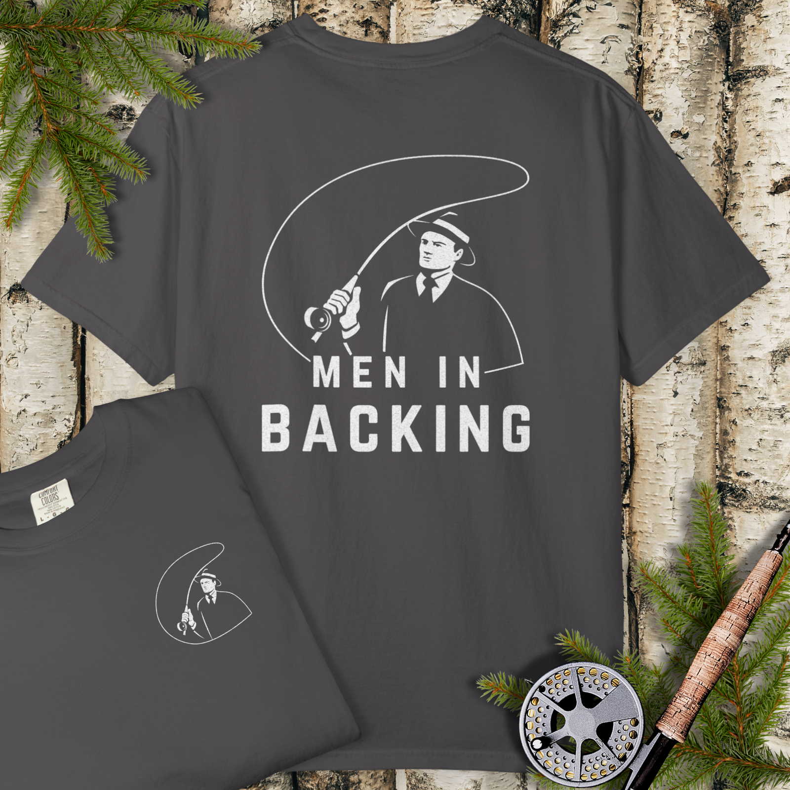 Pepper garment-dyed t-shirt with minimalist angler line art and bold “MEN IN BACKING” graphic.