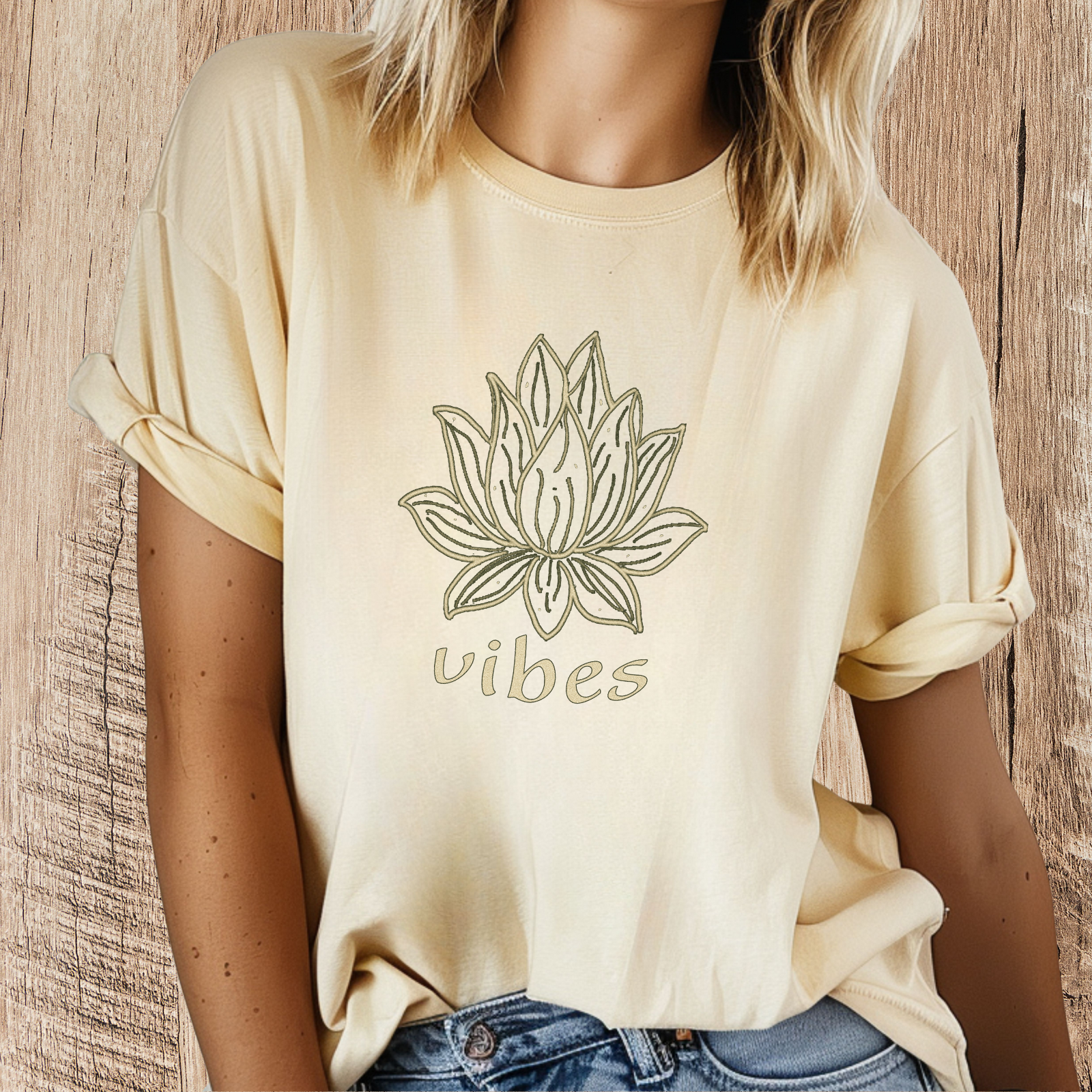 Person wearing a butter lotus “vibes” graphic t-shirt