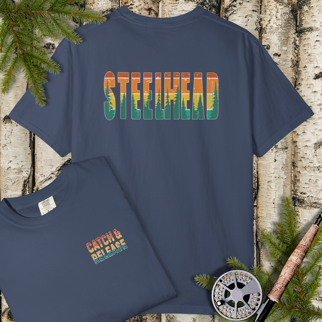 Navy garment-dyed t-shirt with large “STEELHEAD” back print and small “Catch & Release” chest mark.