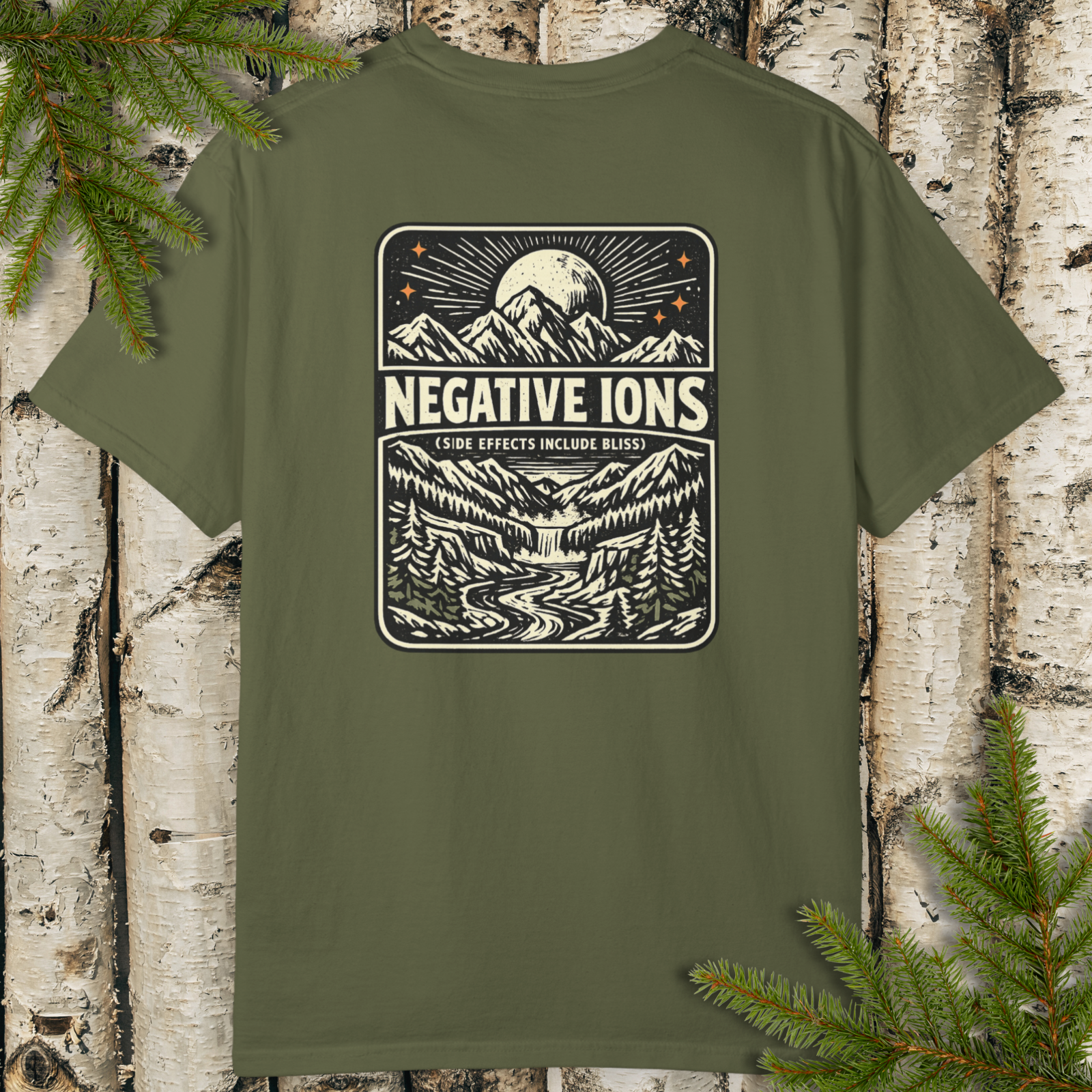 Negative Ions (Side Effects Include Bliss) vintage backprint t-shirt flat lay with mountain moon and winding river graphic.