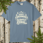 Very Grounded Slightly Feral retro outdoor graphic t-shirt displayed on a flat lay.