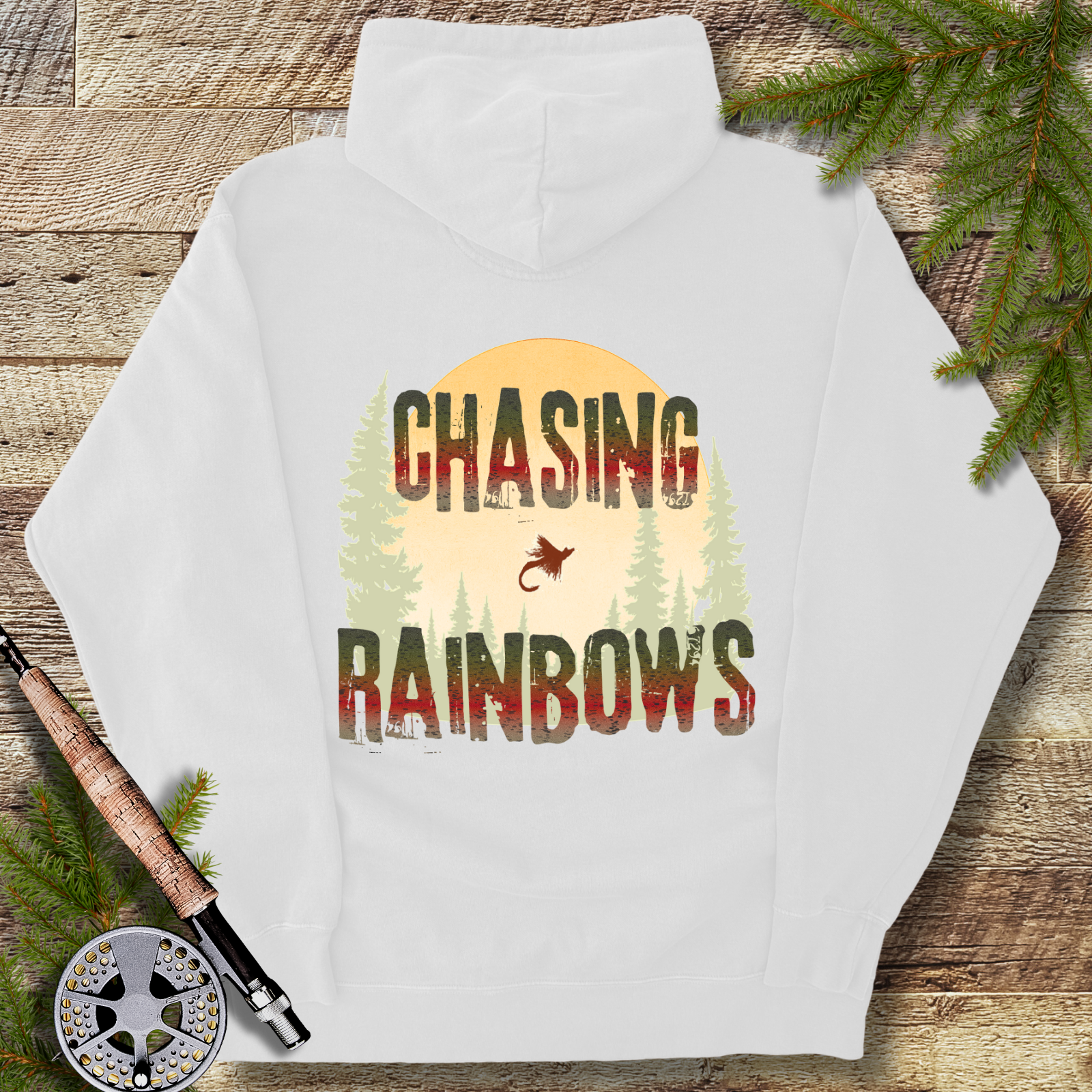 White heavyweight hoodie with “Chasing Rainbows” rainbow trout fly fishing graphic on the back.