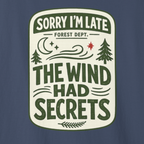 Close-up of ‘Sorry I’m Late The Wind Had Secrets’ vintage forest department badge design with moon and pine trees.