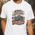 White t-shirt with a graphic design featuring a truck and text, worn by a person.