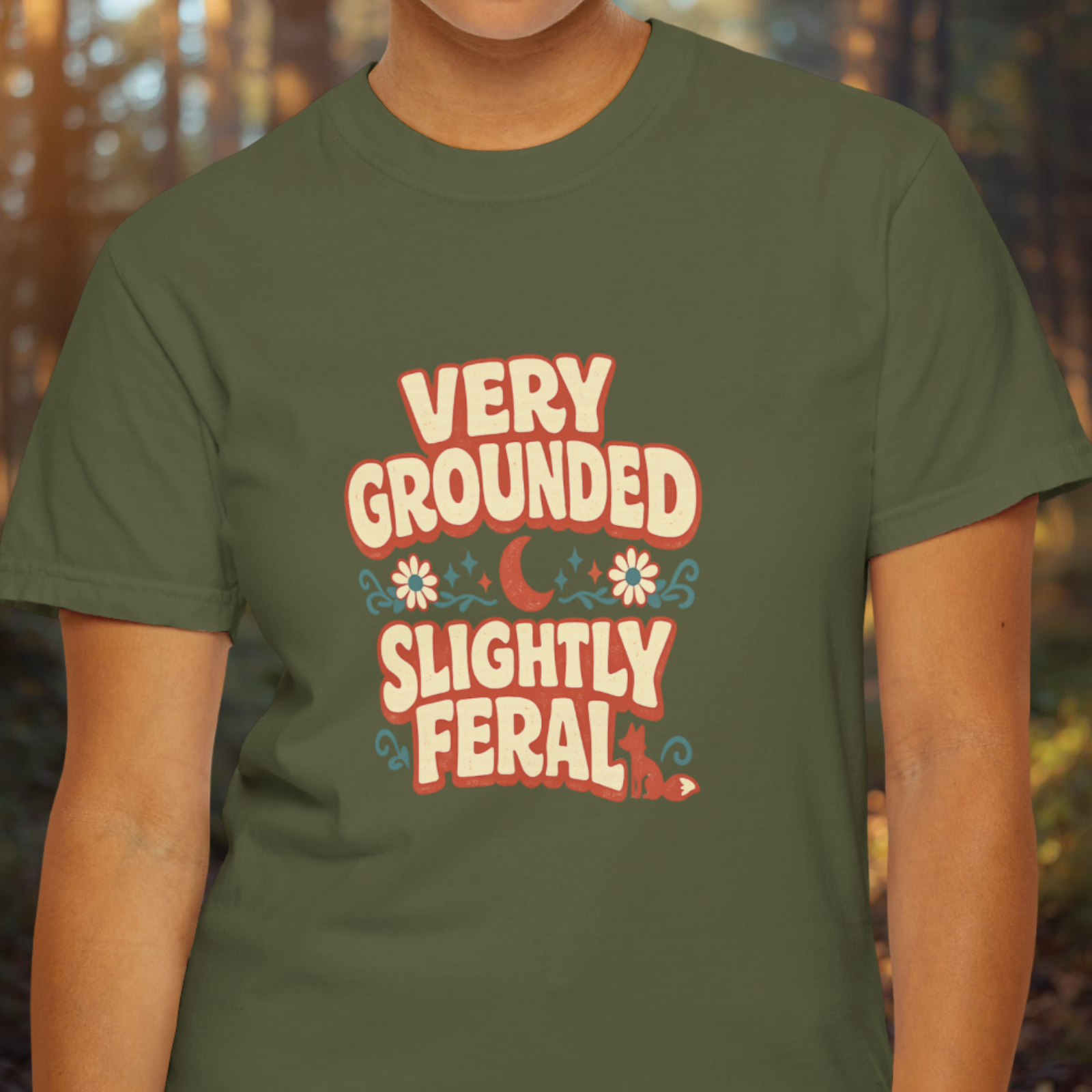 Model wearing Very Grounded Slightly Feral hippie floral graphic tee.