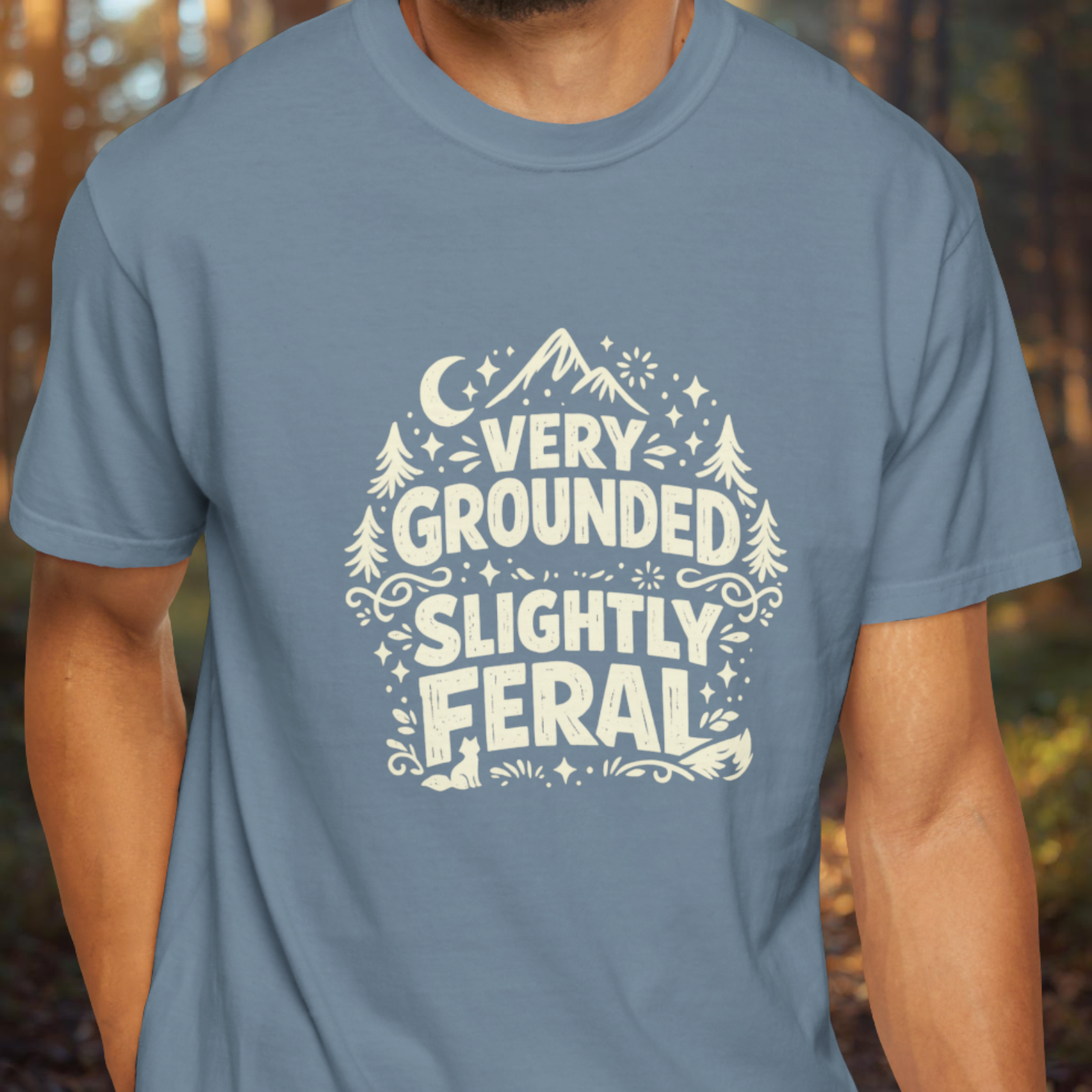 Model wearing Very Grounded Slightly Feral funny nature slogan tee.