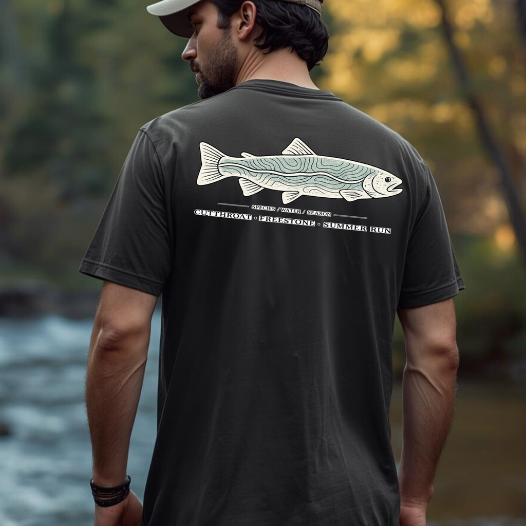 Man wearing Cutthroat Topography trout graphic t-shirt outdoors, showing the large back print