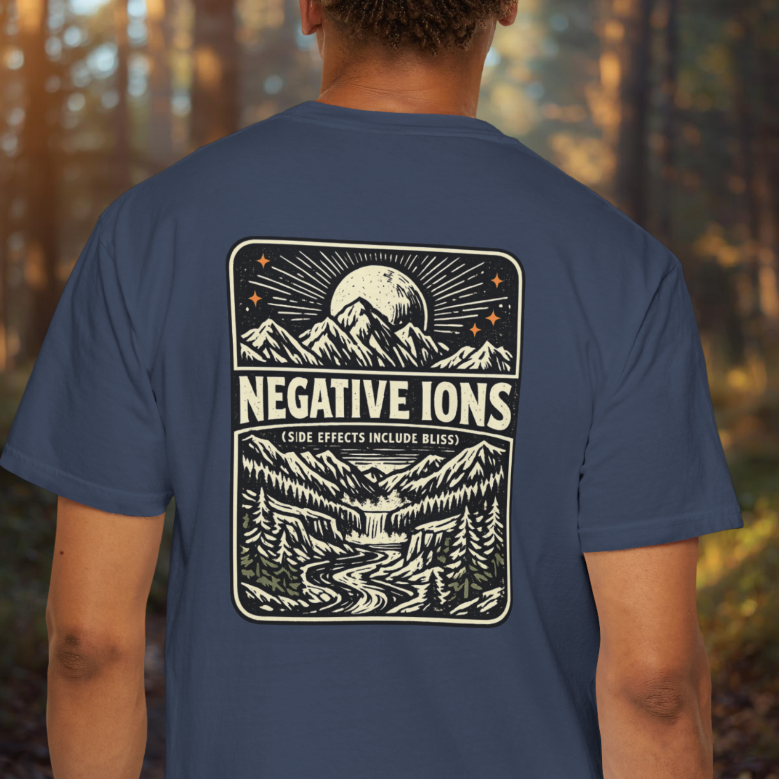 Model wearing Negative Ions (Side Effects Include Bliss) shirt showing vintage mountain moon back design.