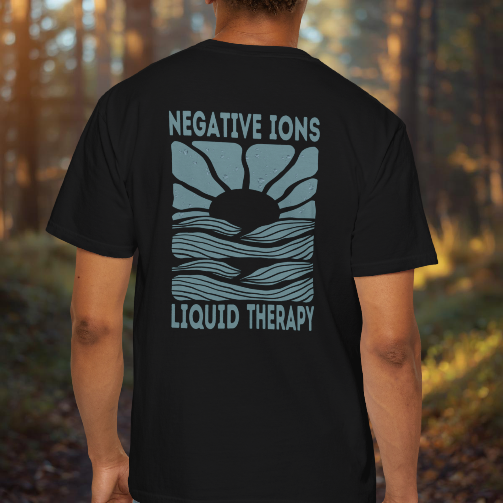 Back view of Negative Ions Liquid Therapy tee with large retro sunrise water design.
