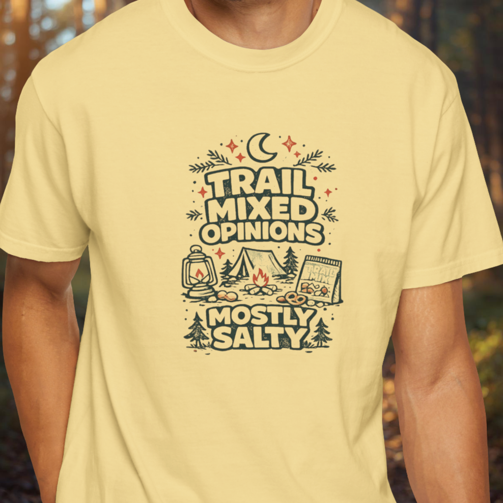 Person wearing a yellow t-shirt with a funny camping graphic reading “Trail Mixed Opinions Mostly Salty” in a vintage outdoor design