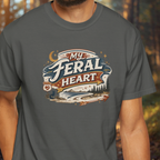 Person wearing a gray t-shirt with 'My Feral Heart' graphic design.