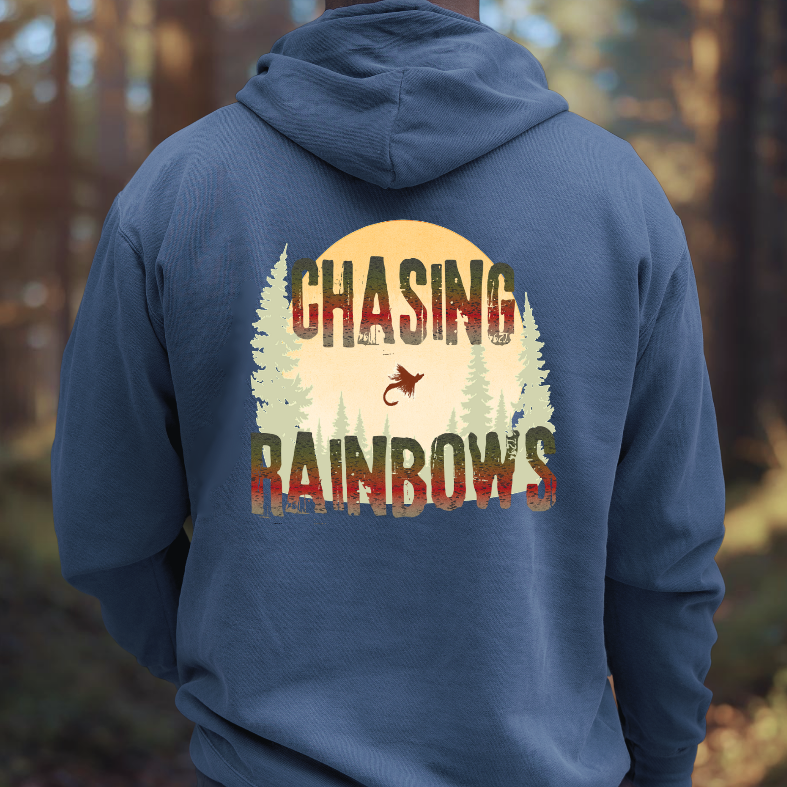 Navy hoodie mockup featuring “Chasing Rainbows” rainbow trout graphic.