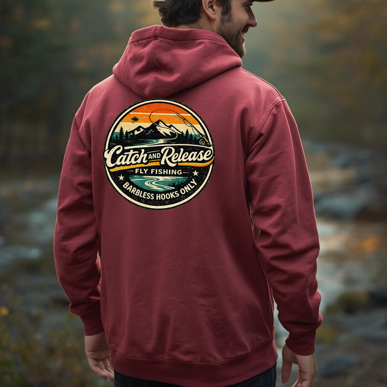 Model wearing a maroon heavyweight hoodie showing the large “Catch & Release” back graphic.