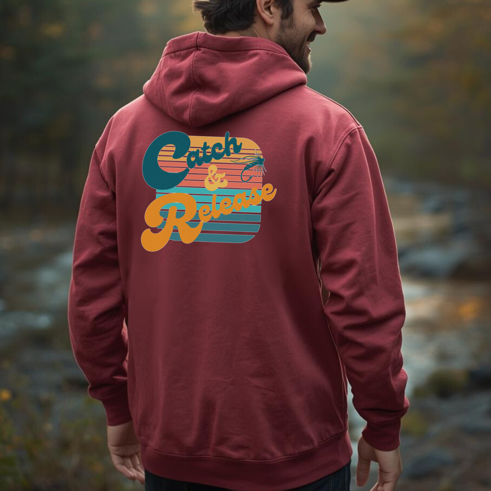 Back view of maroon heavyweight hoodie showing the large “Catch & Release” retro fly fishing design.