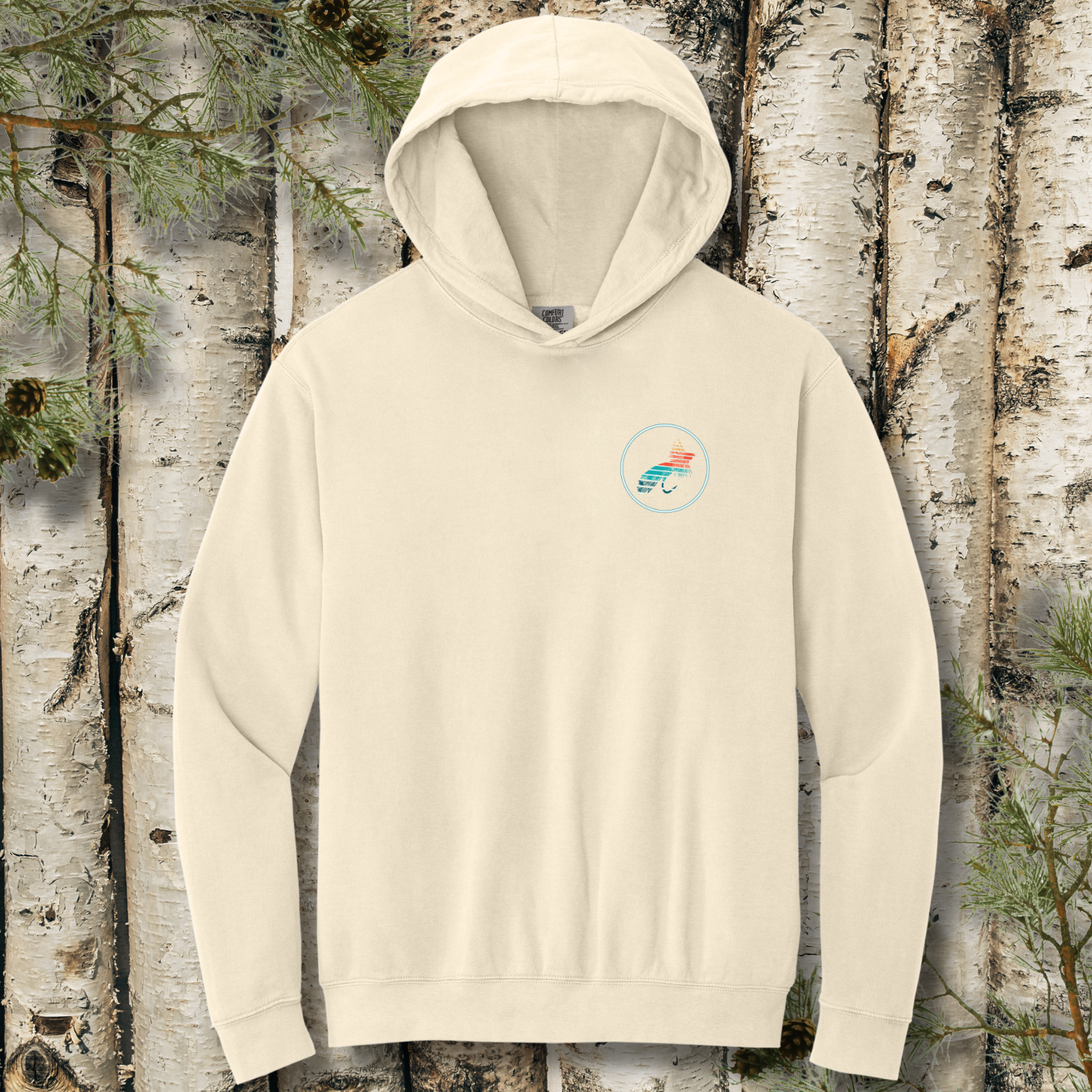 Ivory hoodie with a logo on a background of birch trees