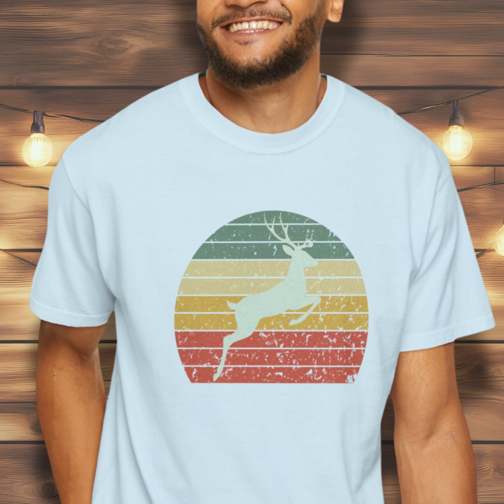 Man wearing stag silhouette retro sunset nature tee.