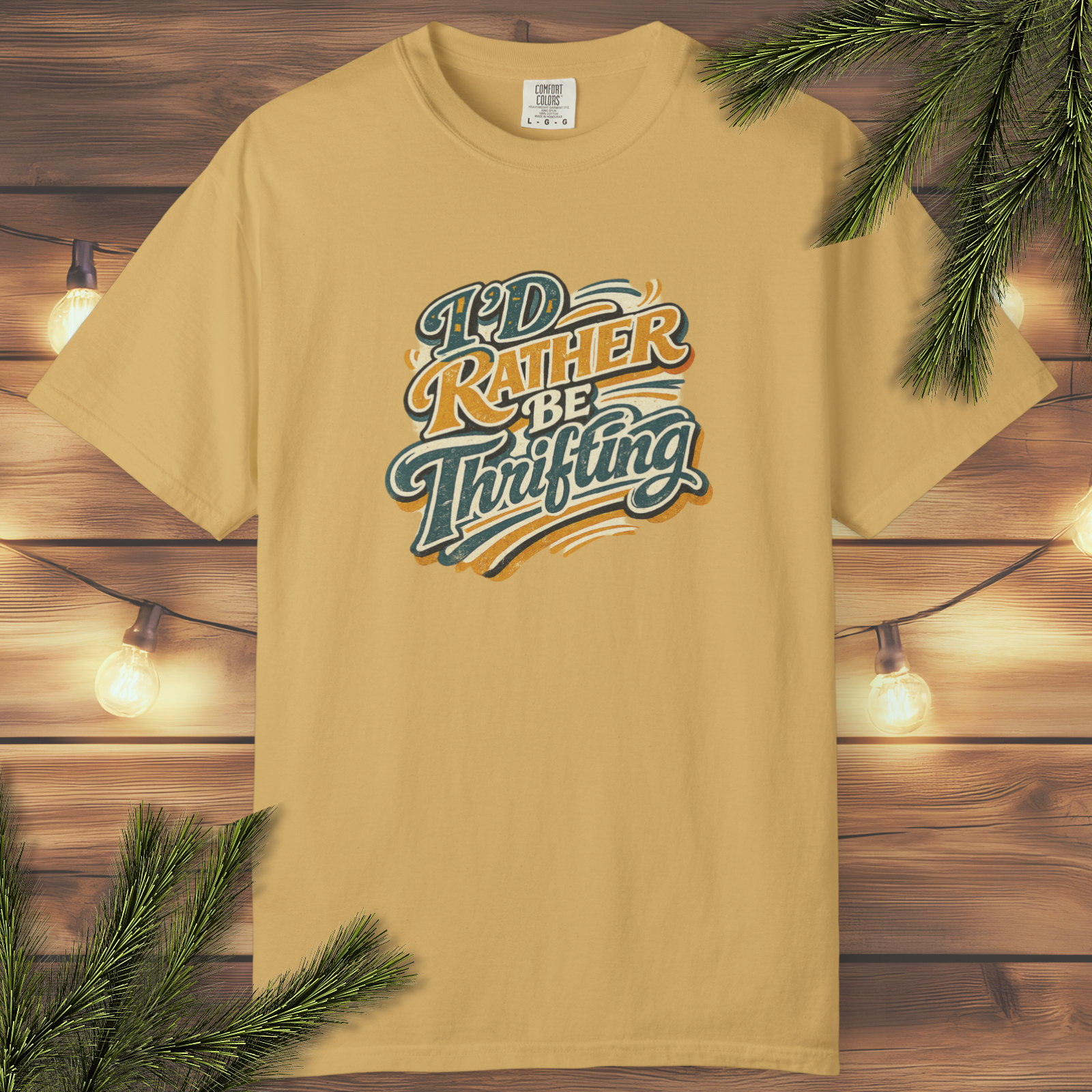 Retro “I’d Rather Be Thrifting” graphic t-shirt in a garment-dyed colorway with vintage-inspired lettering and soft distressed style.