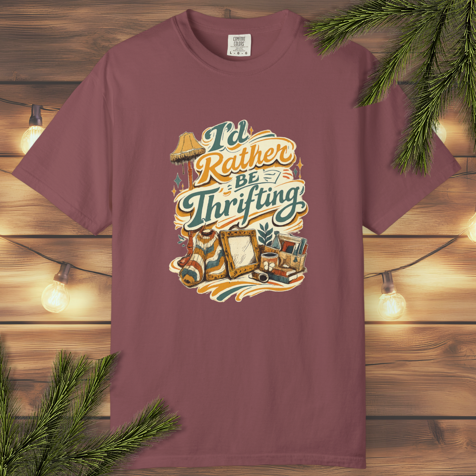 Retro “I’d Rather Be Thrifting” graphic t-shirt with vintage-inspired lettering and illustrated thrift-style details on a garment-dyed unisex tee.

Tags