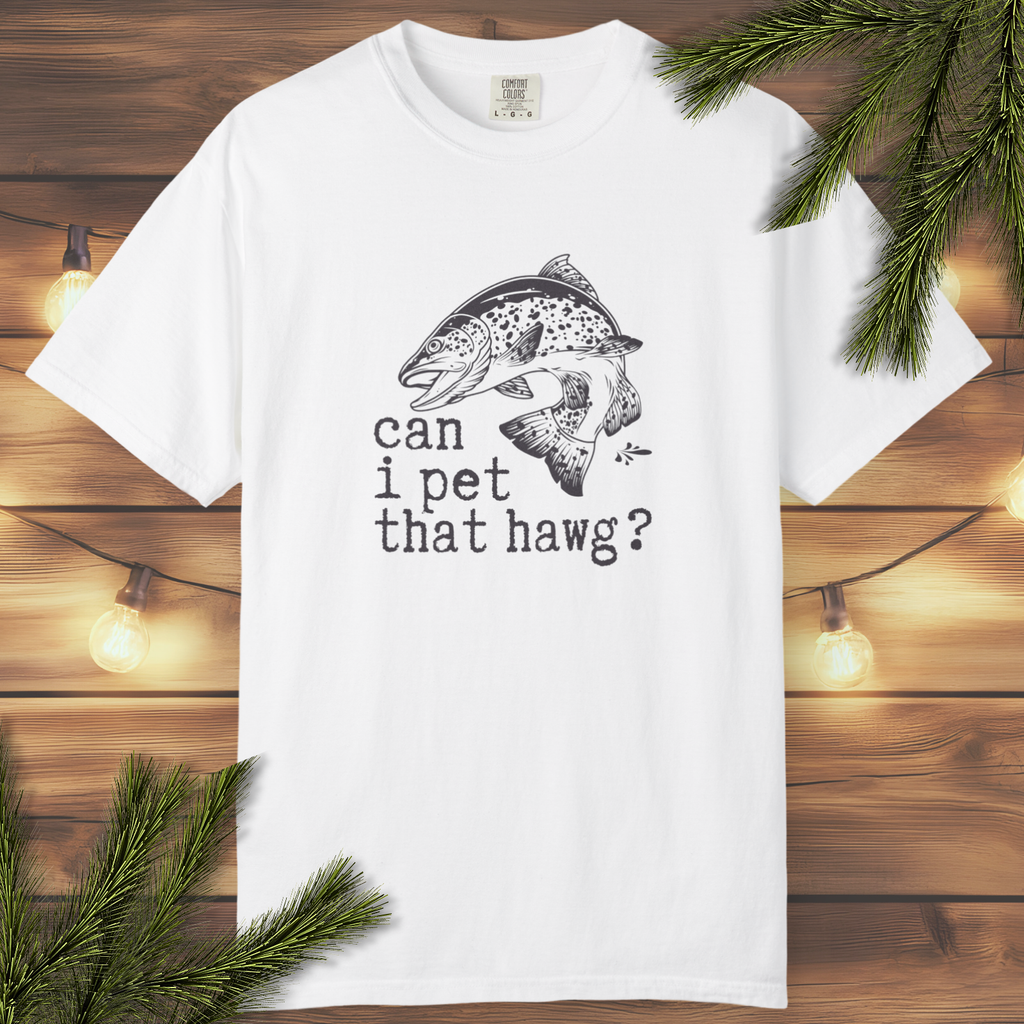 White t-shirt with fish graphic and text on a wooden background