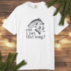 White t-shirt with fish graphic and text on a wooden background