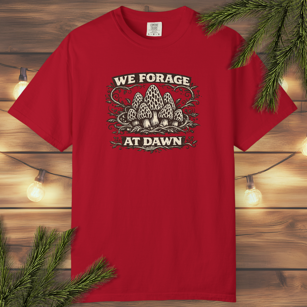 Vintage “We Forage at Dawn” mushroom foraging graphic t-shirt with detailed woodland mushroom illustration in a distressed outdoor style