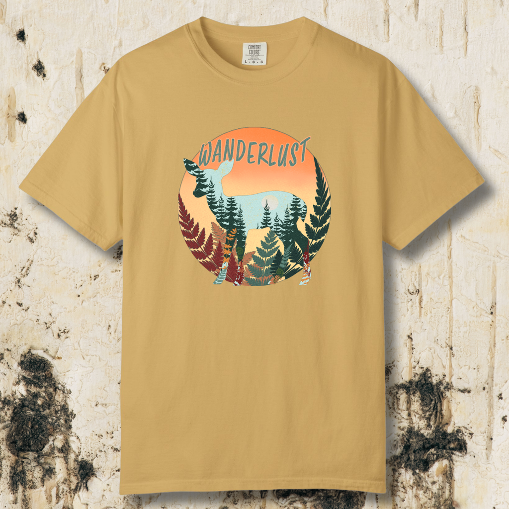 Mustard colored t-shirt with 'Wanderlust'  and fawn graphic design on a textured multi colored fern and pine tree background.